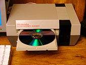 The NES Mac Mini with an open disc tray